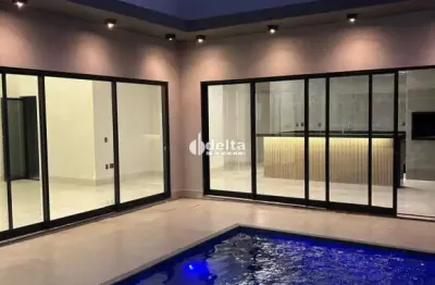 Casa residencial com 3 suítes disponível para venda no bairro shopping park em uberlândia - mg.