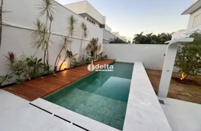 Casa em condomínio com 3 suítes disponível para venda no bairro laranjeiras em uberlândia - mg.