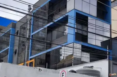 Prédio comercial de 150m² com 3 pavimentos, elevador e fachada envidraçada - projeto aprovado para salas comerciais.