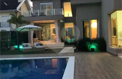 Casa em condomínio fechado com 5 quartos à venda na alameda carinás, 128, alphaville, santana de parnaíba, 760 m2 por r$ 5.900.000