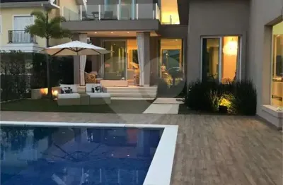 Casa em condomínio fechado com 5 quartos à venda na alameda carinás, 128, alphaville, santana de parnaíba, 760 m2 por r$ 5.900.000