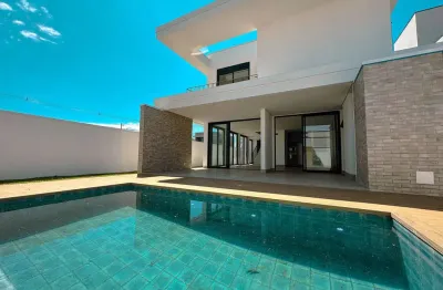Sobrado com 5 suítes e piscina condomínio santorini