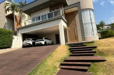 Sobrado no condomínio porta do sol mendanha com 4 suítes plenas.