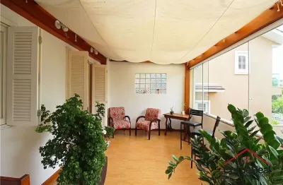 Casa com 3 quartos à venda na rua felizardo de farias, 185, medianeira, porto alegre por r$ 615.000