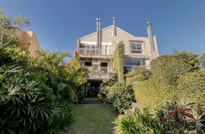 Casa com 3 quartos à venda na Avenida General Barreto Viana, 618, Chácara das Pedras, Porto Alegre por R$ 1.500.000