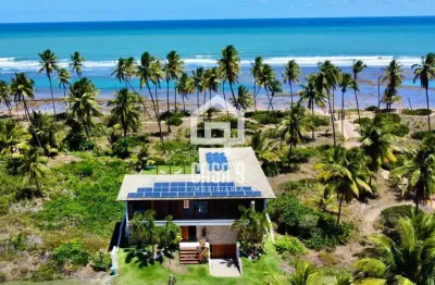 Casa 4 suítes á venda frente mar no condomínio piscinas naturais em praia do forte