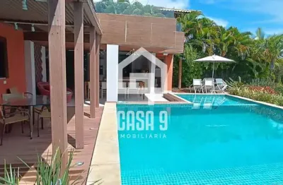 Casa 05 suítes condomínio piscinas naturais em praia do forte bahia