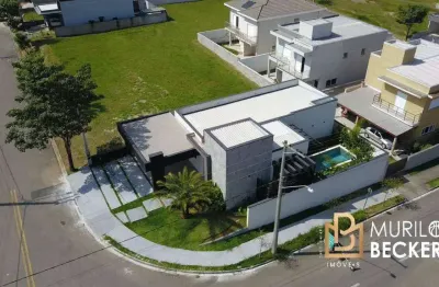 Casa com 3 suítes e piscina no condomínio terras do vale