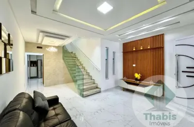 Casa 2 dormitórios, 2 suítes, 120 m2 com churrasqueira, varanda e duas vagas de garagem em praia grande