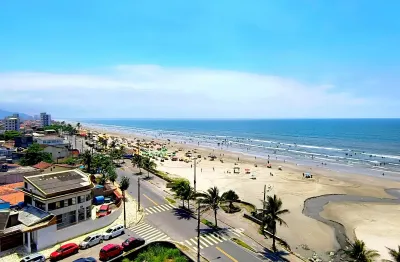 Apartamento com sacada vista mar | prédio com elevador | salão de festas