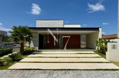 Casa em condomínio dentro da cidade, 3 suítes, piscina com borda infinita.