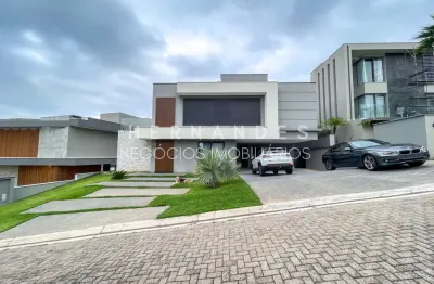Casa de luxo em condomínio no tamboré 11 com 4 suítes, 8 vagas e 458m² construídos!