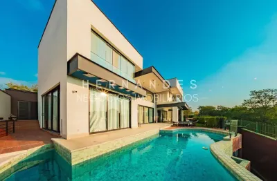 Luxuosa casa de 4 suítes em condomínio exclusivo de alphaville, santana de parnaíba-sp! com 634,95m², piscina e vista incrível.