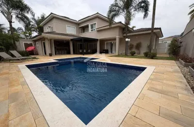 Sobrado 4 suítes, escritório e piscina em condomínio de alto padrão