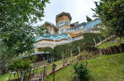 Casa com 5 suítes, 950 m² - alto do capivari - campos do jordão/sp