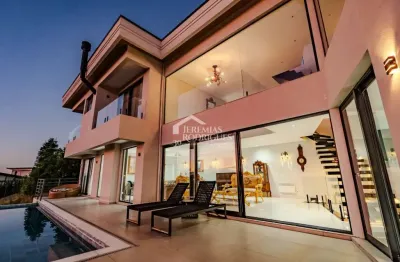 Casa à venda com 5 suítes no condomínio reserva figueiredo em campos do jordão/sp.