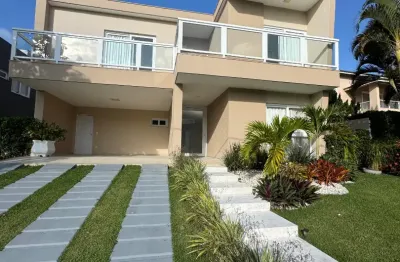 Casa a venda em alphaville litoral norte 1 com 5 suites piscina e área gourmet