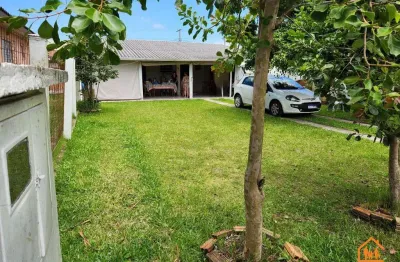 Casa mobiliada à venda em imbé com churrasqueira, jardim e um lindo pátio arborizado