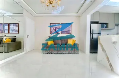 Apartamento de 2 quartos (1 suite), sala integrada com espaço gourmet e 2 vagas cobertas