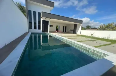 Casa em condomínio três quartos uma suíte e piscina.