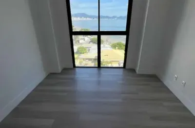 Apartamento frente mar com 3 suítes e 2 vagas de garagem na praia do perequê em porto belo