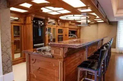 Apartamento com 4 suítes e 3 vagas de garagem em meia praia - itapema/sc