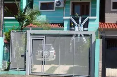 Casa com 3 quartos à venda na Rua dos Guenoas, 897, Guarujá, Porto Alegre