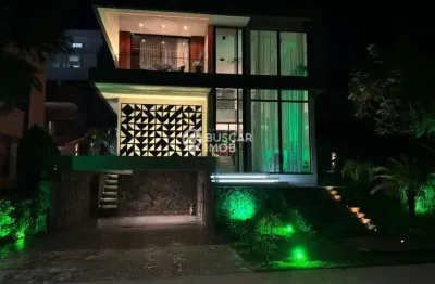 Casa em condomínio fechado com 4 quartos para alugar na Rua Guarajuba, Alphaville (Abrantes), Camaçari, 300 m2 por R$ 20.000