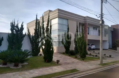 A casa possui irrigacao automatica, cortina eletrica, portas dos quartos eletricas, energia fotovoltaica, garagem para 4 carros sendo que ao lado da piscina tem um quintal que consegue estacionar mais