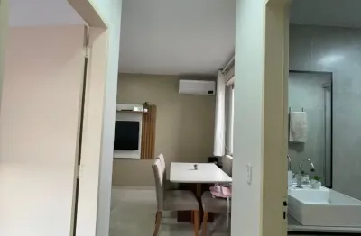 Apartamento com 2 quartos, living 2 ambientes portaria 24 horas, playground, salão de festa.