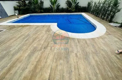 Casa a venda com uma sala de tv no condomínio reserva da serra