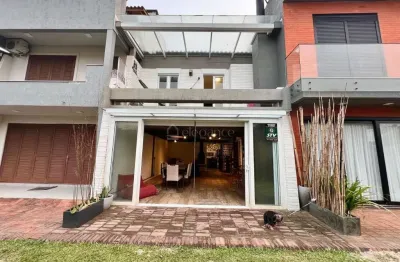 Casa em condomínio fechado com 3 quartos à venda na rua irerê, 561, atlântida, xangri-lá por r$ 600.000