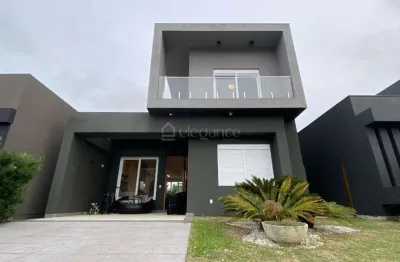 Casa em condomínio fechado com 4 quartos à venda na rua rio camisas, 231, centro, xangri-lá por r$ 1.550.000