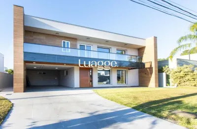 Linda casa de 5 suítes com fundos lago no terraville