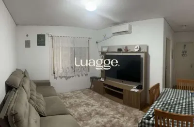 Apartamento de 2 dormitórios, living, cozinha, área de serviço e banheiro social.