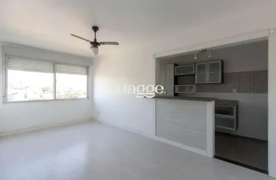 Apartamento semimobiliado à venda no bairro cristal, 2 dormitórios, 2 banheiros, 1 vaga coberta e vista livre para o guaíba