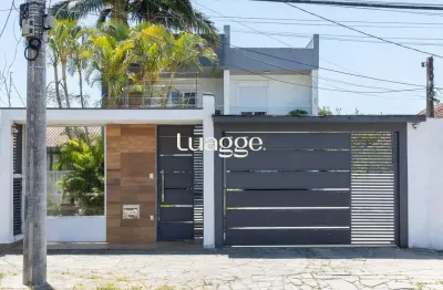 Excelente casa de 3 dormitórios, 3 suítes e 2 vagas no bairro cavalhada.