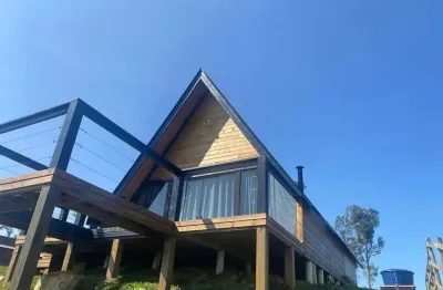 Terreno de 1.500m² com chalé  entre águas mornas e rancho queimado