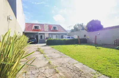 Linda casa terrea com excelente espaço de jardim e estacionamento