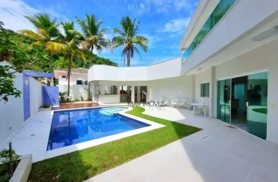 Linda casa com 5 suítes em condomínio fechado de alto padrão na praia de pernambuco no guarujá!
