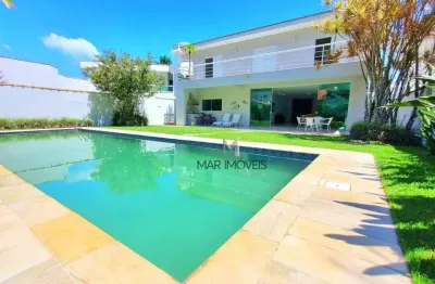 Linda casa em condomínio fechado de alta padrão a 200 metros da praia de pernambuco no guarujá!
