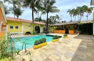 Confortável residência com 4 suítes e área de lazer no condomínio acapulco  - mercuri imóveis - imobiliária no guarujá