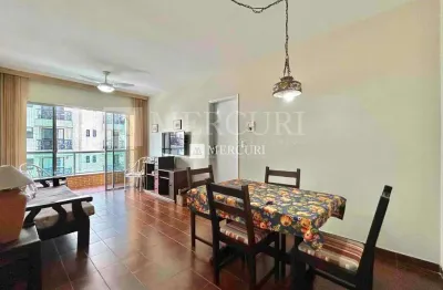 Apartamento na praia da enseada com sacada e ar condicionado