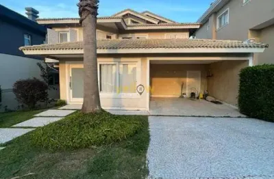 Casa em condomínio fechado em alphaville com 580m², 4 suítes e 5 banheiros - venda e locação por r$3.950.000