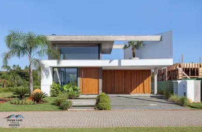 Casa em condomínio 3 dormitórios à venda condomínio reserva das águas torres/rs