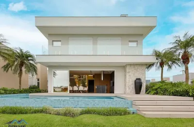 Casa em condomínio 4 dormitórios à venda condomínio reserva das águas torres/rs