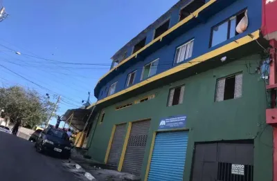 Prédio residencial e comercial com 10 casas e 5 salões renda 11.000