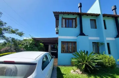 Casa em condomínio fechado com 2 quartos à venda na Avenida dos Ipês Amarelos, 160, Tarumã, Viamão
