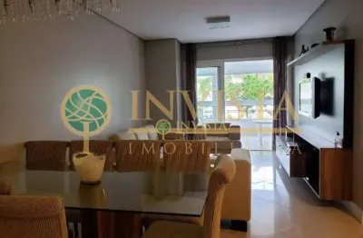 À venda na Praia de Jurerê Internacional! Sacada com churrasqueira, 151m², semi mobiliado, 3 suítes e 2 vagas de garagem.