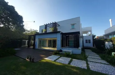 Condomínio fechado, 4 suítes, semi mobiliado, 4 vagas de garagem - á venda no porto da lagoa